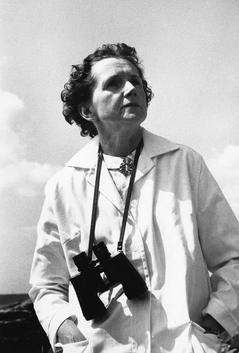 Black and white photo of Rachel Carson wearing binoculars