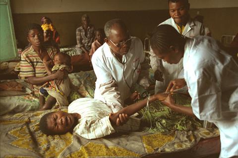 A patient with sleeping sickness being treated by doctors in the DRC