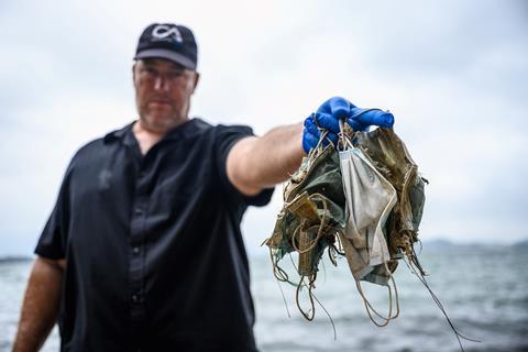 An image showing face masks found on the beach