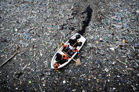 An image showing a sink floating in a sea of plastic