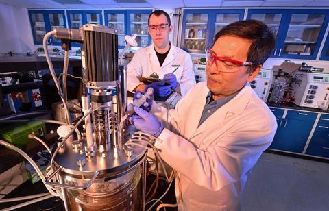 A bioreactor used to ferment ethanol from corncob waste being loaded with yeast.