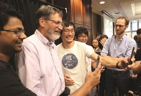 George P. Smith taking selfies with students at the University of Missouri 