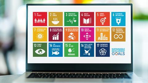 Laptop displaying logo of The Sustainable Development Goals, a collection of 17 interlinked global goals set up in 2015 by the United Nations General Assembly