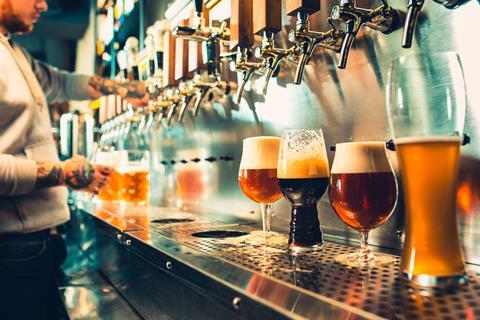 A range of different beers at a bar