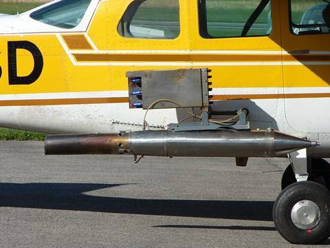 Cessna 206, rebuilt for cloud seeding, with detail view of silver iodide generator