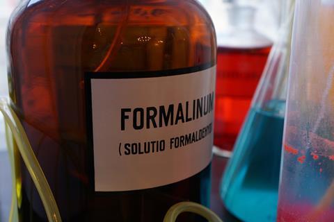 A bottle of formalin with inscription in latin in a drugstore museum 