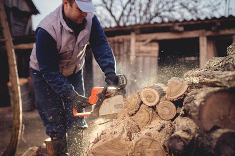 Cutting logs with a chainsaw