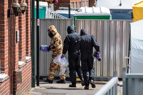 Emergency workers in protective suits search around John Baker House Sanctuary Supported Living