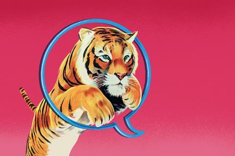 Tiger jumping through speech bubble