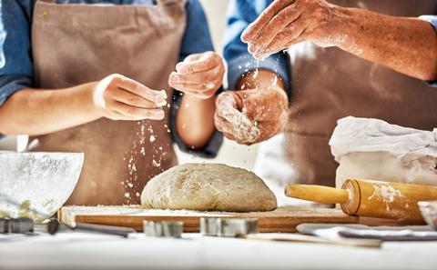Two bakers making bread