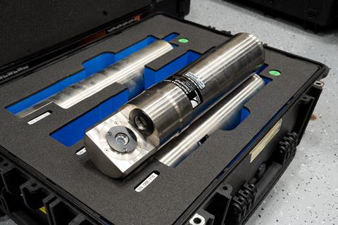 A metal instrument in a cushioned case