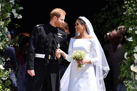 Prince Harry, Duke of Sussex and his wife Meghan, Duchess of Sussex leave from the West Door of St George's Chapel, Windsor Castle, in Windsor on May 19, 2018.