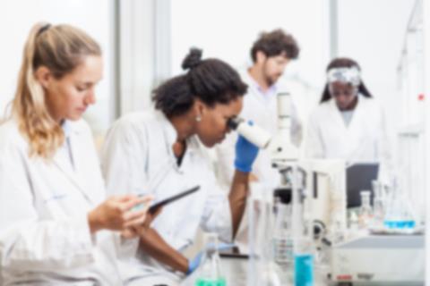 Blurry image of scientsts in the lab