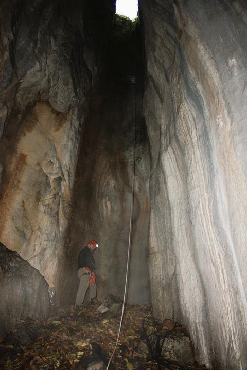 A photograph showing the 20m high vertical shaft that is the only way in or our of the cave