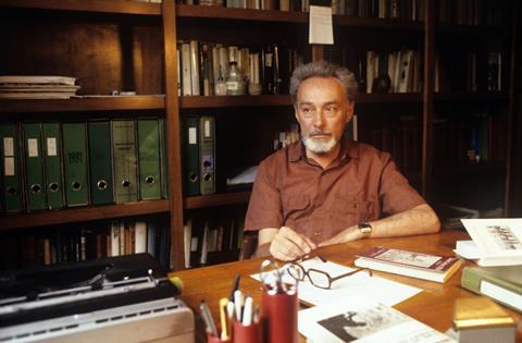 An image showing Primo Levi at his desk