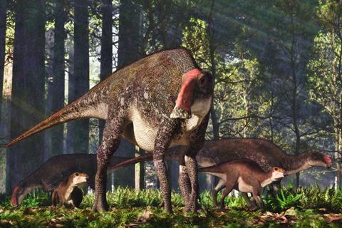 A group of adult and young dinosaurs in a forest