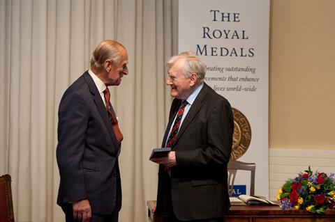 A photograph showing Sir John Cadogan being presented with a medal