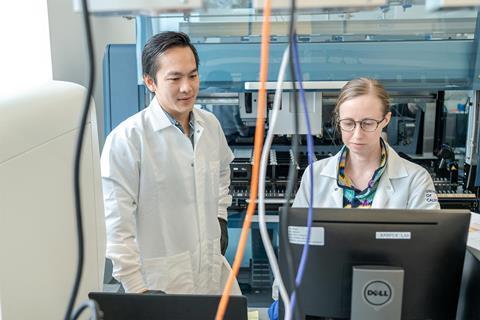 A photo of two researchers in a lab