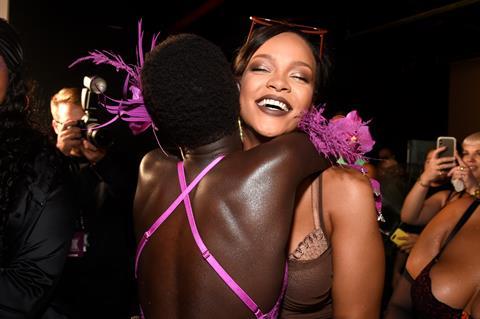 Rihanna hugging a model