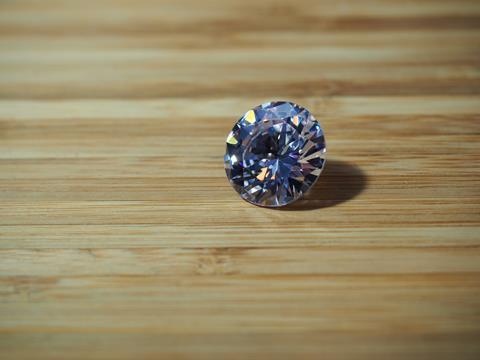 Diamond cut colored zirconium crystal