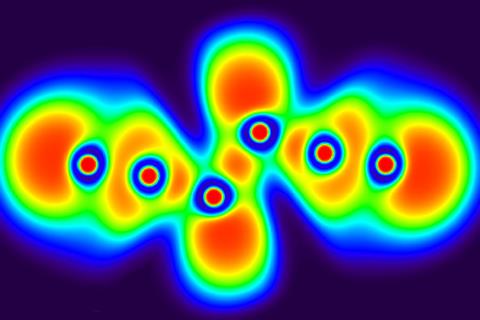 Small red circles surrounded by blue then merging green with yellow and red spots and a blue outline