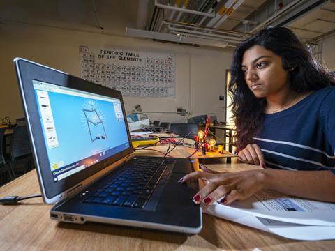 An image showing a University of Colorado student using an online simulator to design a circuit