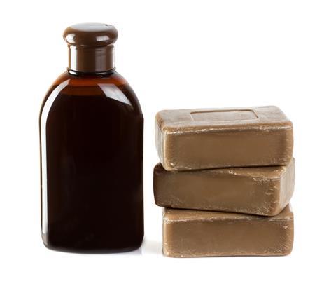 Birch coal tar soap and shampoo isolated on white 