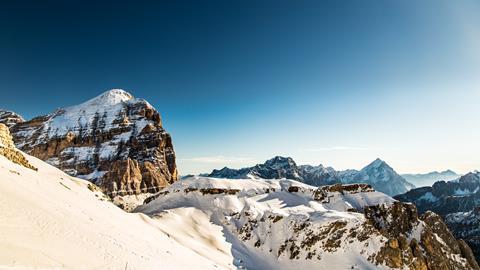 Winter in the italian alps, with the ski slope full of snow