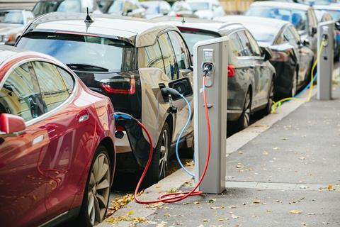 A photos of electric cars at a recharging station