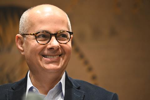 A smiling Omar Yaghi at a press conference