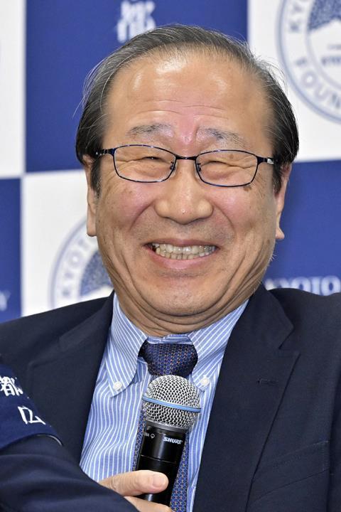 A smiling Susumu Kitagawa at a press conference