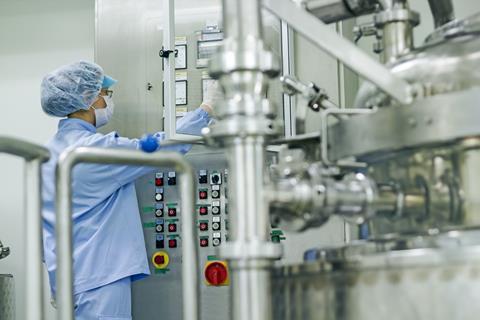 Worker in industrial lab setting