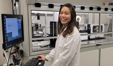 A scientist at a computer in a lab