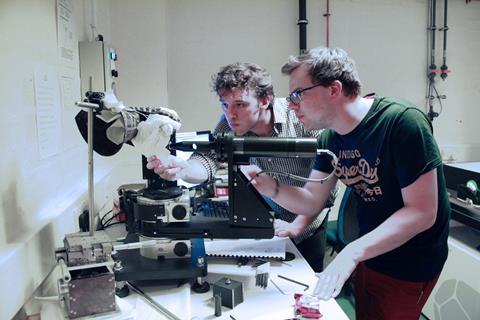 Dr Alex Mellor and Tom Wilson checking the placement of the gauntlet in the ellipsometer