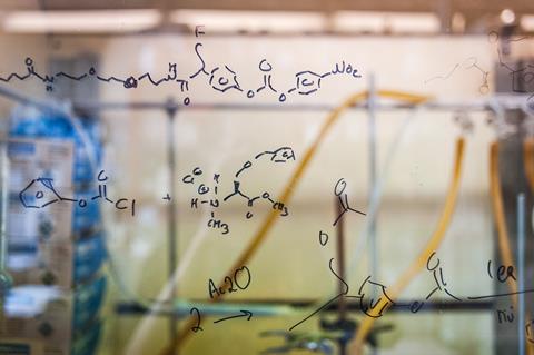 Fumehood with chemical structures draw on the glass