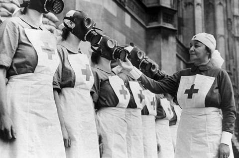 Nurses from the House of Lords Red Cross Detachment wearing gas masks,