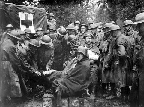 Wounded German prisoners receiving medical attention at first-aid station of 103rd and 104th Ambulance Companies. WWI. Sept. 1918.