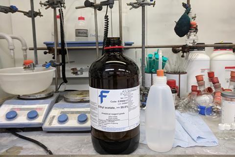 Bottle of ethyl acetate in fumehood