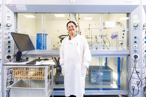 Woman in front of fume cupboard