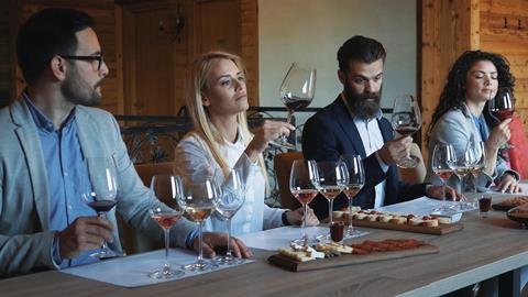 An image showing people tasting wine