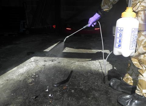 An image showing applying decon to a concrete floor