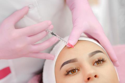 Woman receives botox injection