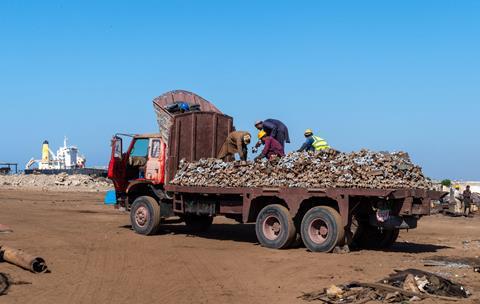 Workers loading a truck at Gadani ship-breaking yard