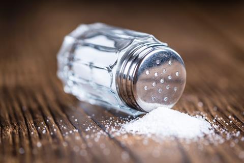 A salt shaker tipped on its side