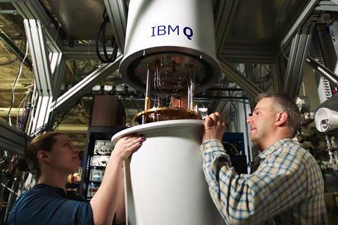 An image showing IBMers Sarah Sheldon and Pat Gumann working on a quantum dilution refrigerator