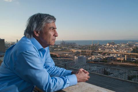 A man looks out over a city