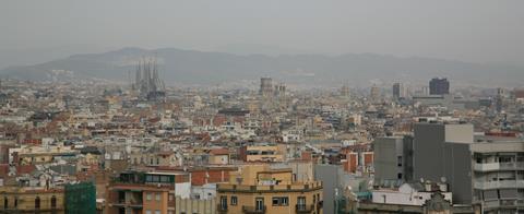 An image showing the skyline of polluted Barcelona