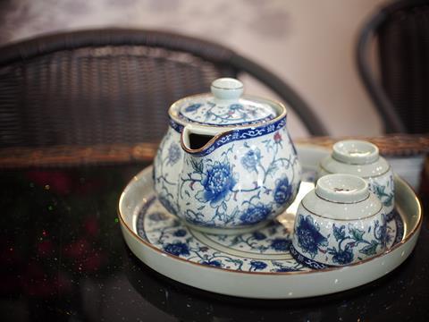 A bone china tea set painted with blue flowers