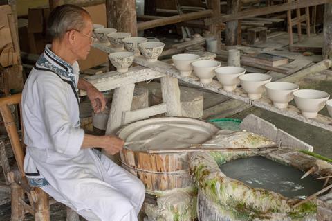 Porcelain Craftsman working in the Pottery workshop