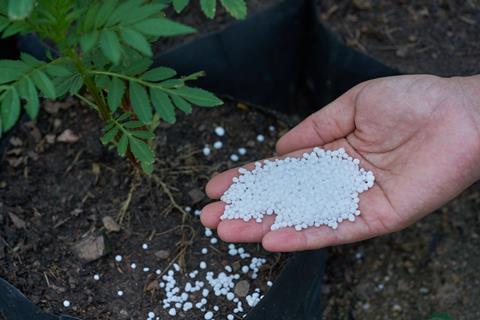 Fertilizer in famer's hand